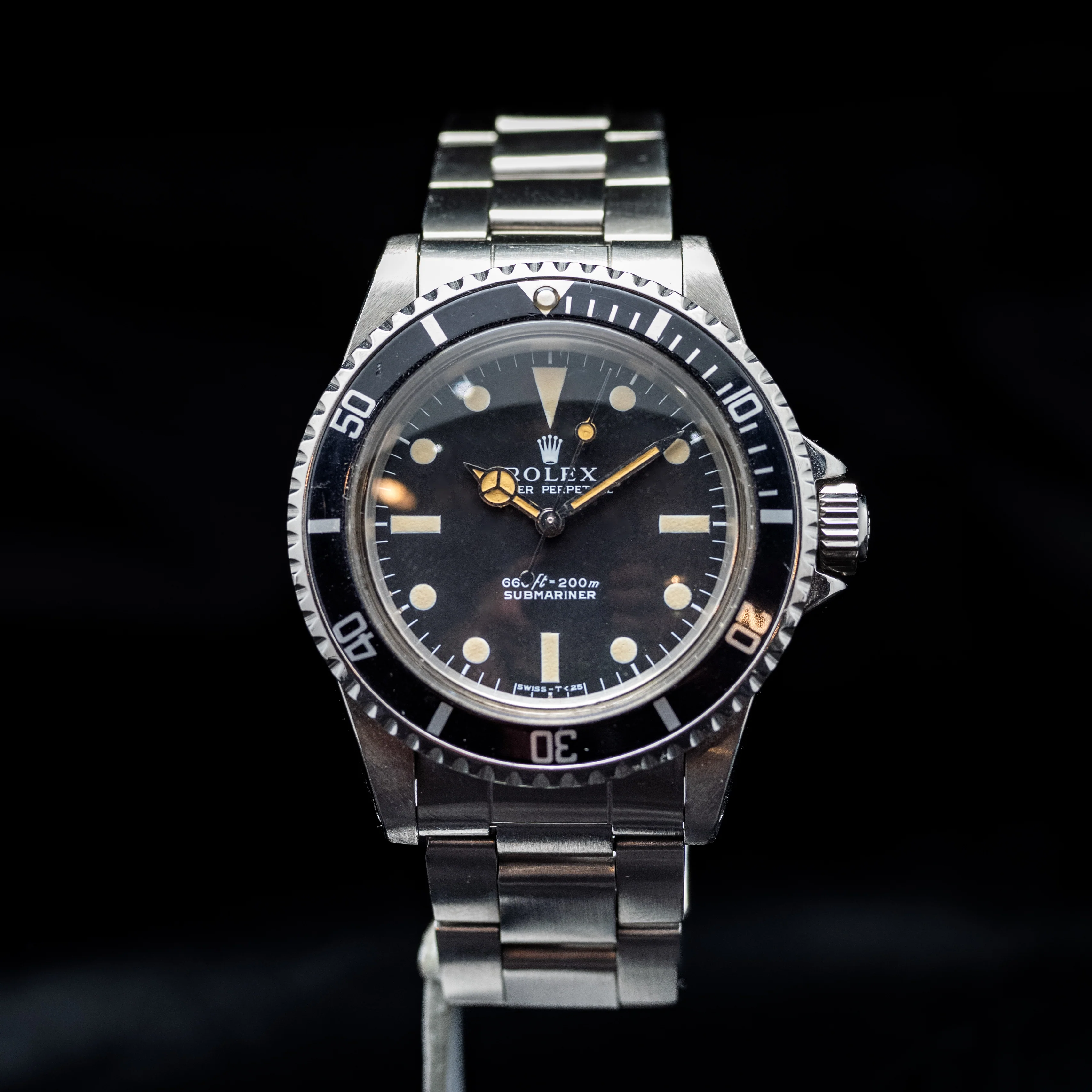 Photo of a luxury watch on a black cushion
