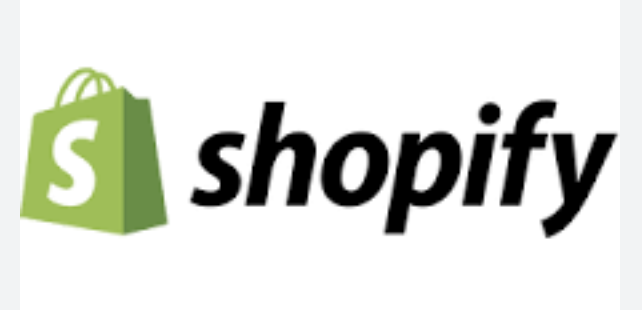 Shopify is written in black on a white background with a green shopping bag next to it.