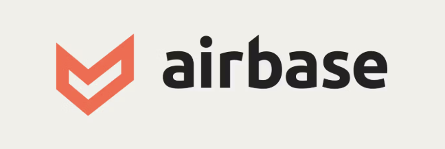 Airbase written in black with a red logo on the left, all on a beige background.